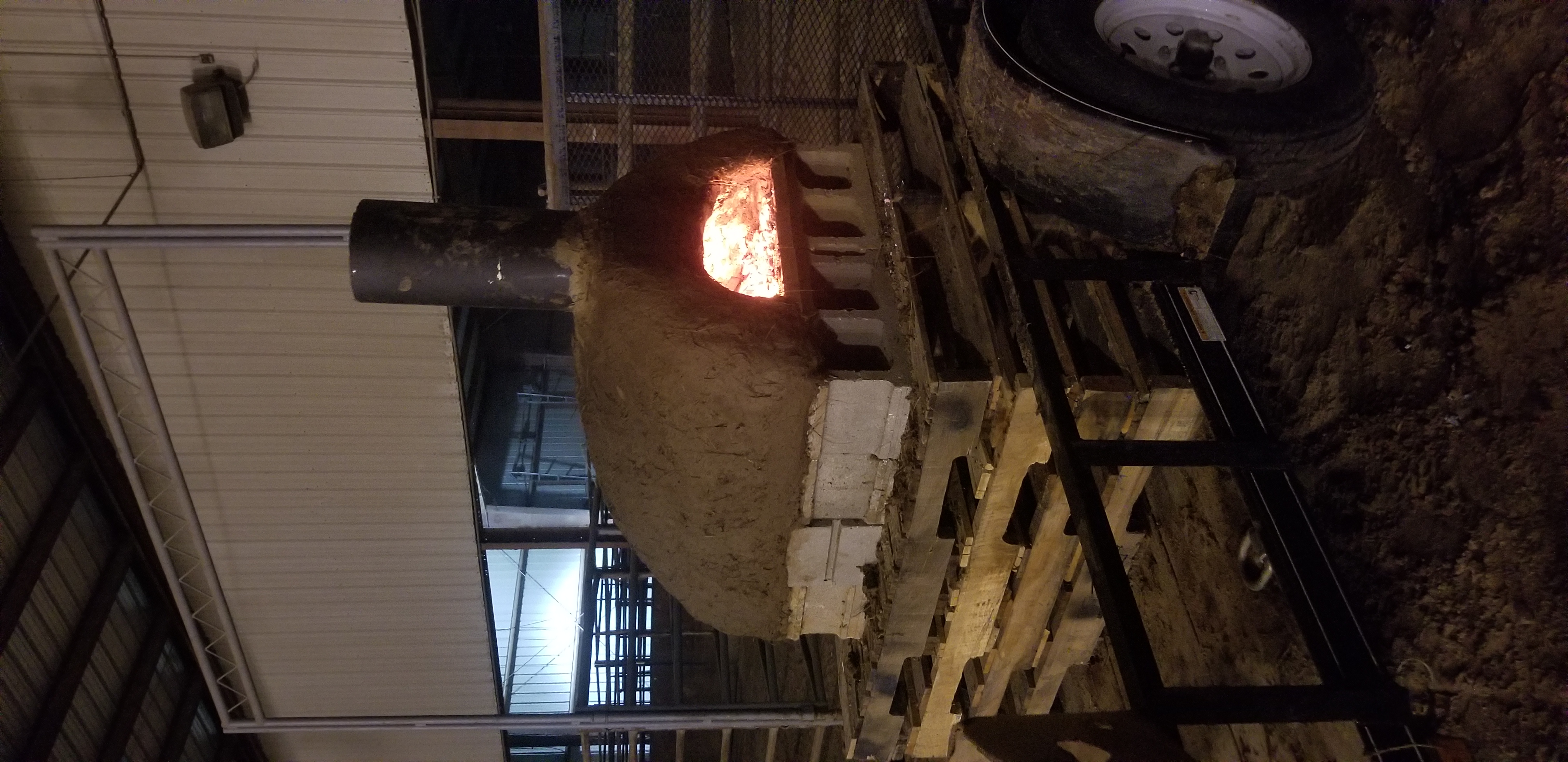 Firing a full sized cob oven made at the fair
