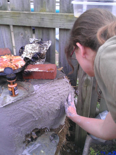 Plastering a rocket stove