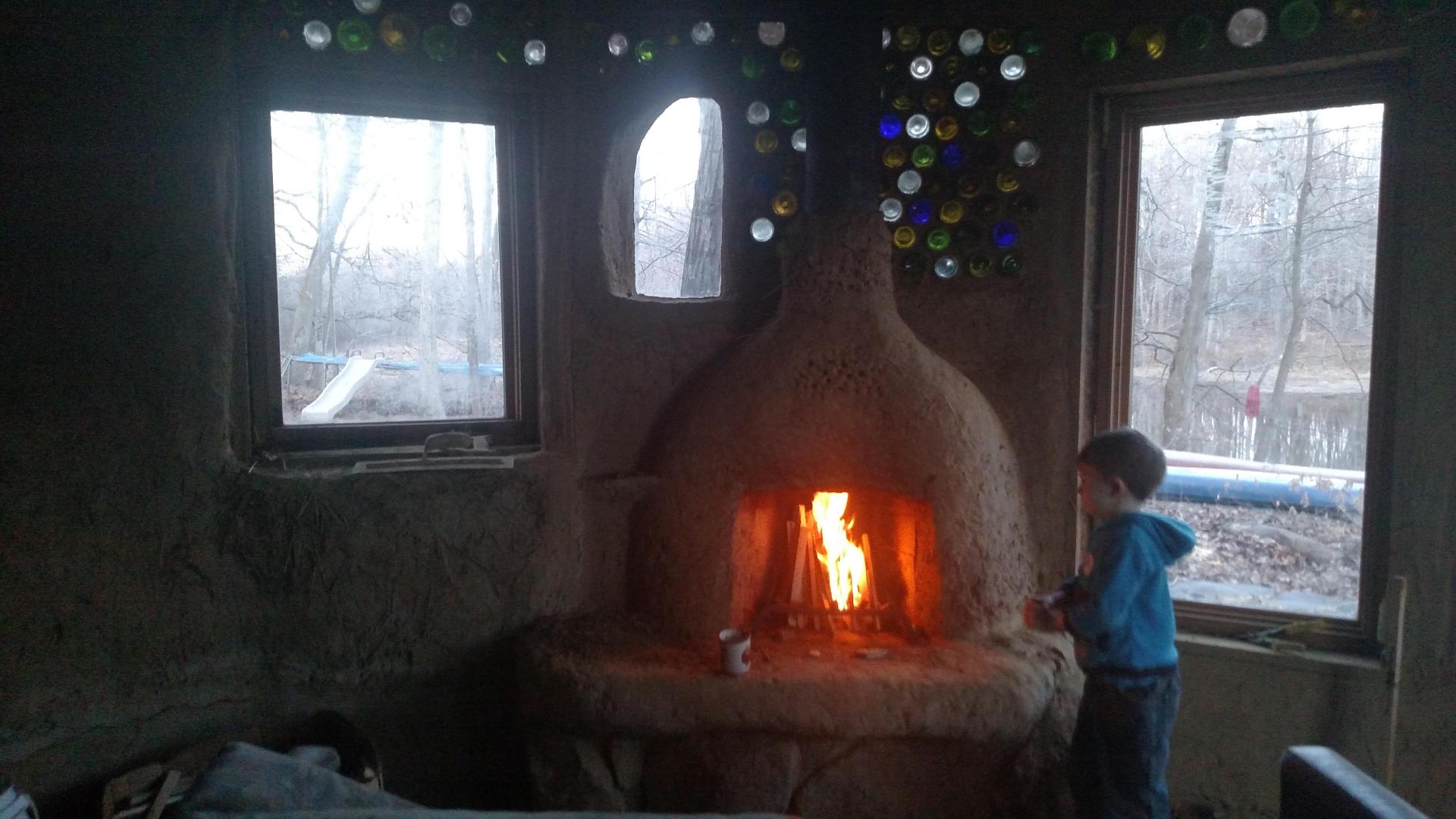 Firing up the Cob Rumford Fireplace